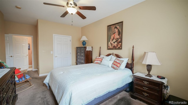 carpeted bedroom with baseboards and ceiling fan