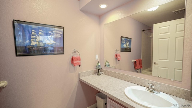full bath featuring shower / bathing tub combination, vanity, and visible vents