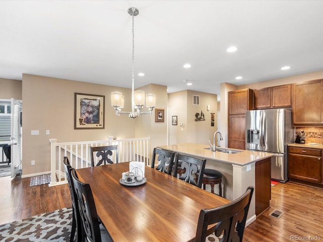 569 Jackson St, Lafayette, CO 80026 - dining space with dark wood finished floors, recessed lighting, and a chandelier