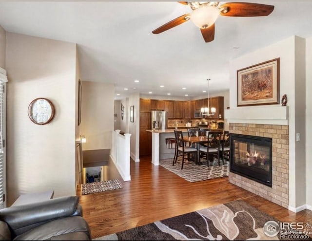 569 Jackson St, Lafayette, CO 80026 - living area featuring a ceiling fan, wood finished floors, and recessed lighting