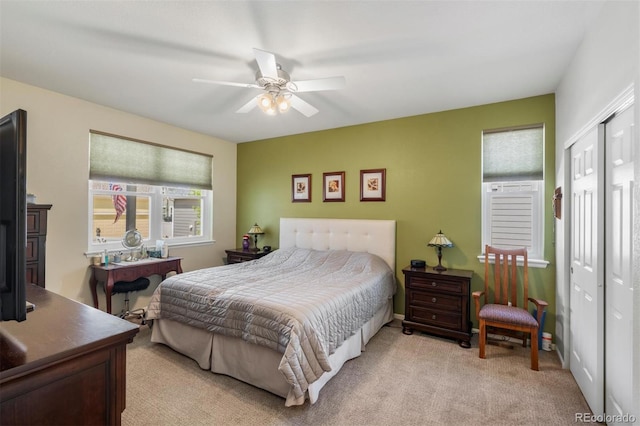 569 Jackson St, Lafayette, CO 80026 - bedroom with light carpet, a closet, and a ceiling fan