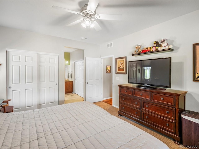 569 Jackson St, Lafayette, CO 80026 - bedroom featuring light carpet, a ceiling fan, connected bathroom, and a closet