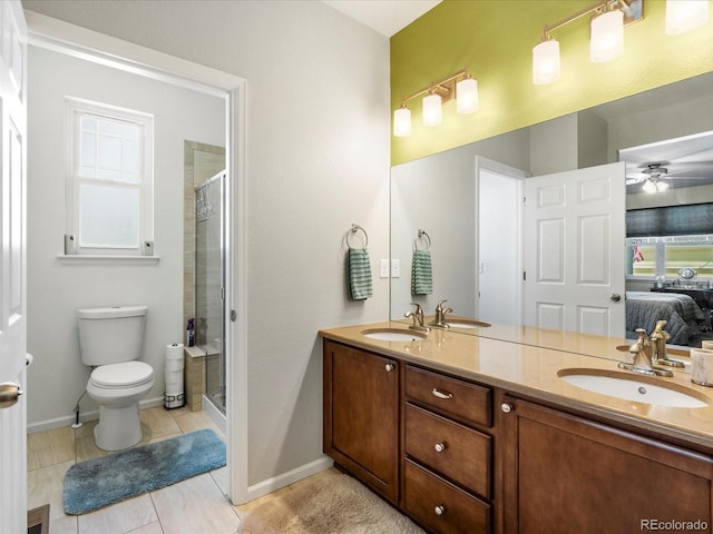 569 Jackson St, Lafayette, CO 80026 - ensuite bathroom featuring double vanity, a stall shower, and a ceiling fan