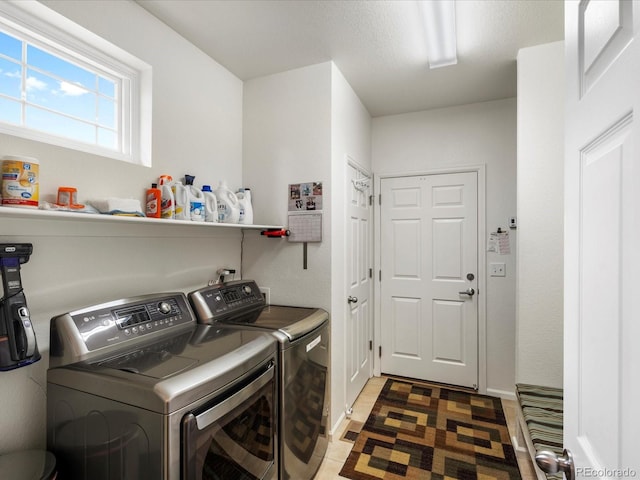 569 Jackson St, Lafayette, CO 80026 - washroom with separate washer and dryer and baseboards