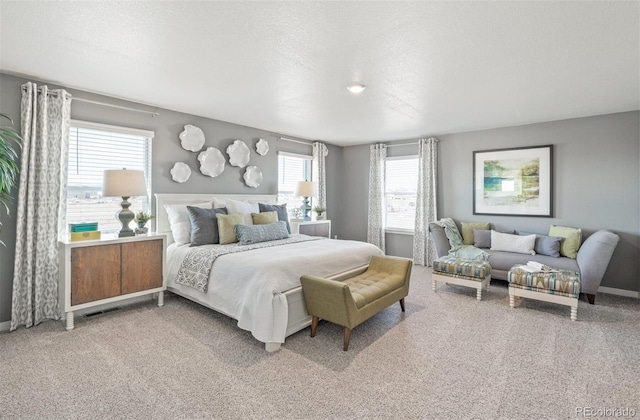 carpeted bedroom featuring a textured ceiling