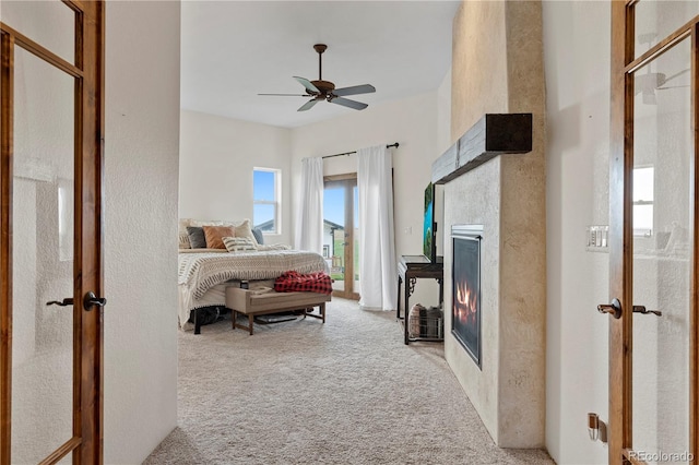 bedroom featuring ceiling fan and light colored carpet