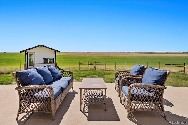 view of patio / terrace with outdoor lounge area and a rural view