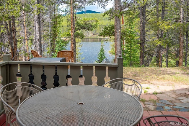 view of patio / terrace featuring outdoor dining area and a water view