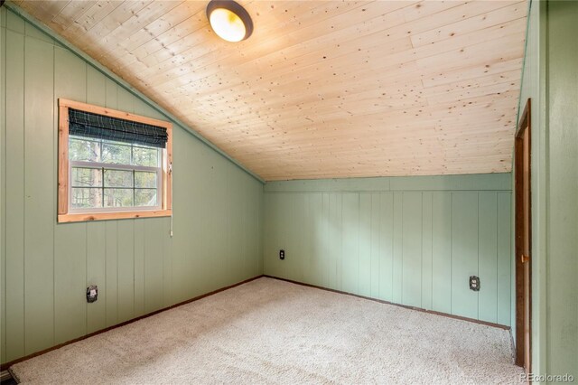 additional living space featuring wooden ceiling, light carpet, wood walls, and lofted ceiling