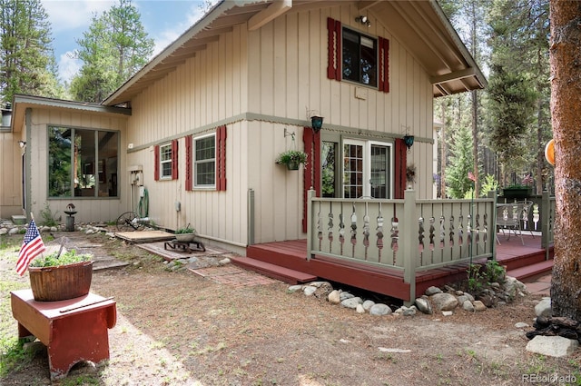 view of home's exterior featuring a wooden deck