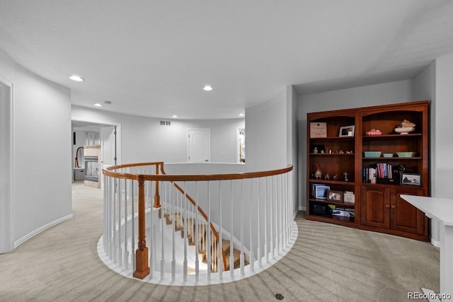 10837 Fox Sedge Way, Highlands Ranch, CO 80126 - hall featuring an upstairs landing, light colored carpet, and recessed lighting