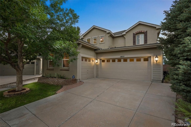 10837 Fox Sedge Way, Highlands Ranch, CO 80126 - view of front facade with stucco siding, concrete driveway, and a garage