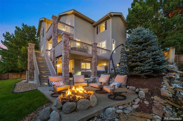 10837 Fox Sedge Way, Highlands Ranch, CO 80126 - back of house with an outdoor fire pit, a patio, a balcony, stairs, and a deck