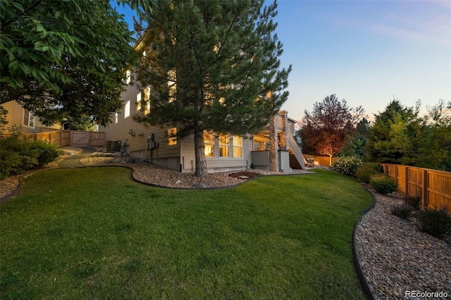 10837 Fox Sedge Way, Highlands Ranch, CO 80126 - back of property at dusk with a fenced backyard
