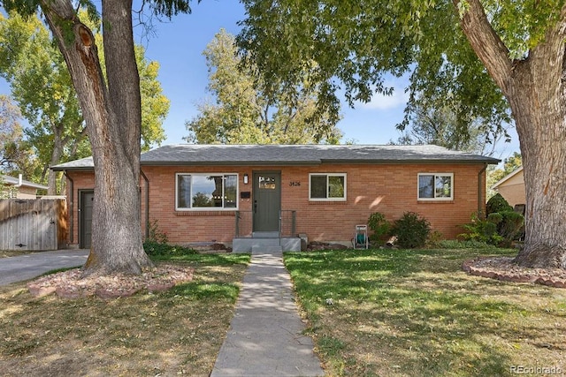 single story home featuring a front yard