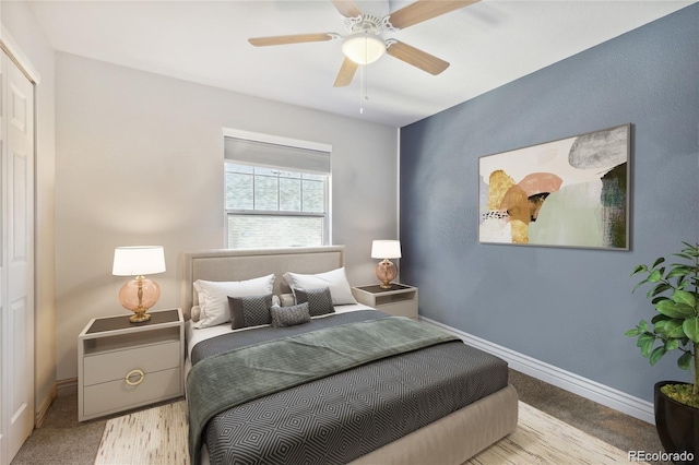 carpeted bedroom with ceiling fan