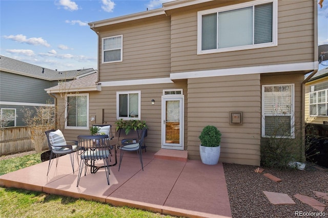 back of property featuring a patio area