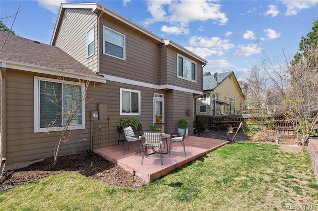 back of property featuring a yard and a patio