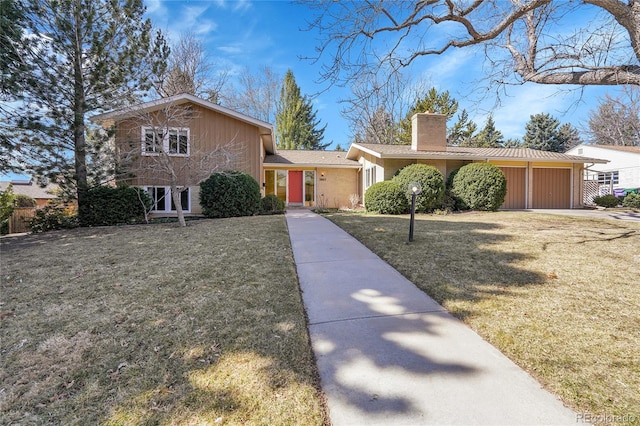 view of front of property featuring a front yard and a chimney