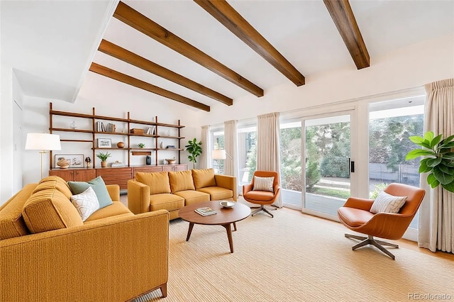 living area with lofted ceiling with beams