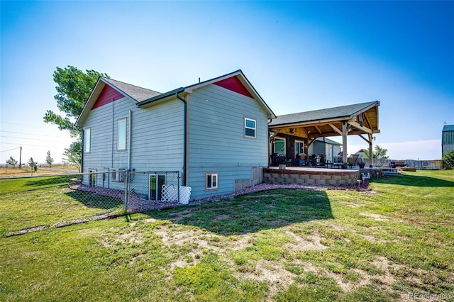 view of home's exterior with a yard