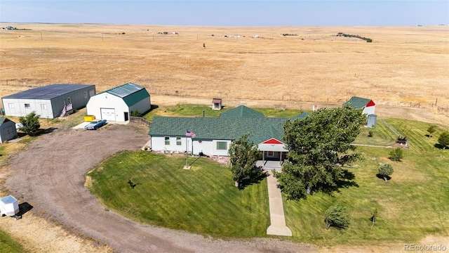 birds eye view of property with a rural view