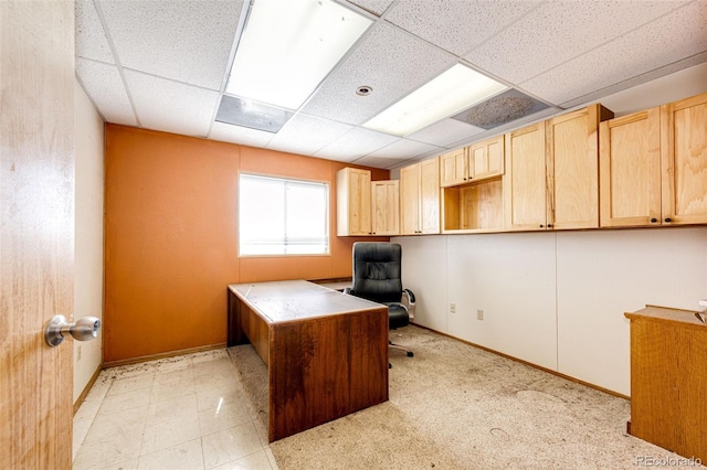 home office with light carpet and a drop ceiling