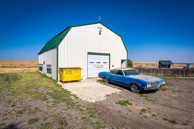 garage featuring a rural view