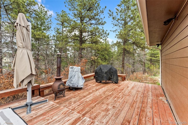wooden terrace with area for grilling