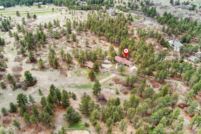 birds eye view of property with a rural view