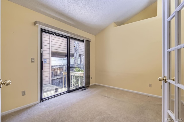 7500 E Dartmouth Ave Unit 22, Denver, CO 80231 - empty room featuring carpet flooring, lofted ceiling, a textured ceiling, and baseboards