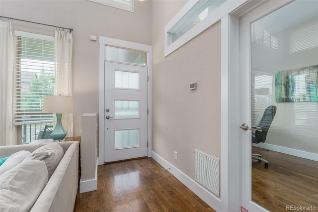 2868 Kingston St, Denver, CO 80238 - foyer entrance with dark wood-style flooring and baseboards