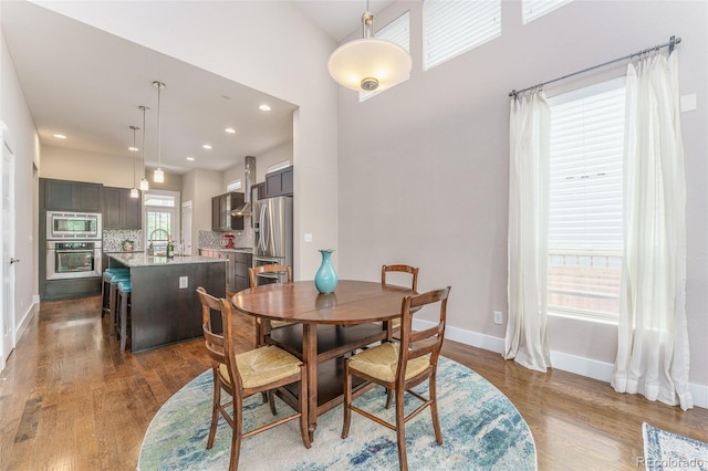 2868 Kingston St, Denver, CO 80238 - dining room with dark wood finished floors, recessed lighting, and a towering ceiling