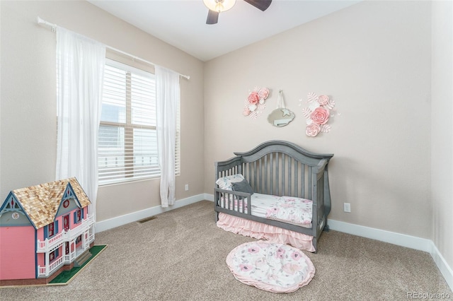 2868 Kingston St, Denver, CO 80238 - carpeted bedroom with a crib and ceiling fan