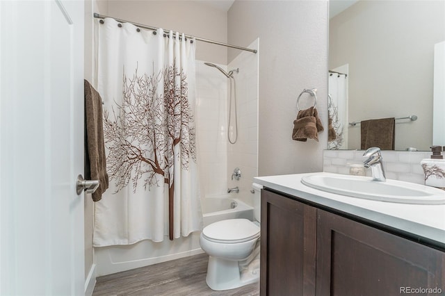 2868 Kingston St, Denver, CO 80238 - bathroom featuring shower / bath combo with shower curtain, vanity, and wood finished floors