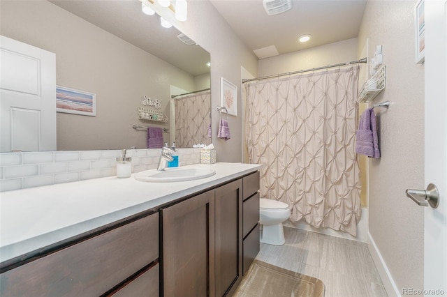 2868 Kingston St, Denver, CO 80238 - full bath featuring vanity, tasteful backsplash, and shower / bath combination with curtain