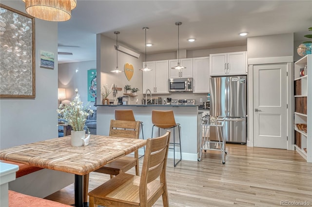 114 Old Stage Rd Unit D, Salida, CO 81201 - dining space with light wood-style flooring and recessed lighting