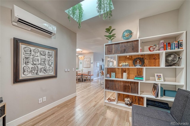 114 Old Stage Rd Unit D, Salida, CO 81201 - hallway with a wall unit AC, a skylight, wood finished floors, and baseboards
