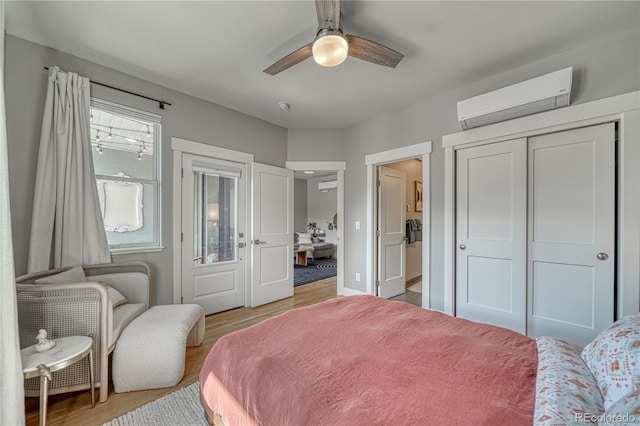 114 Old Stage Rd Unit D, Salida, CO 81201 - bedroom with a wall mounted AC, light wood-style floors, a closet, and ceiling fan