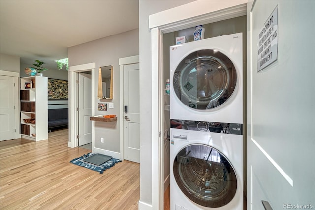 114 Old Stage Rd Unit D, Salida, CO 81201 - laundry room with stacked washer and clothes dryer and wood finished floors