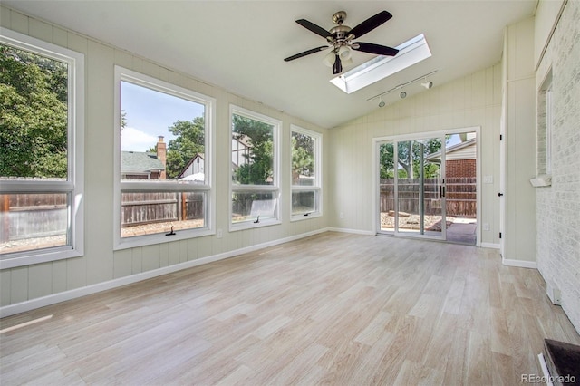 2518 S Dawson Way, Aurora, CO 80014 - unfurnished sunroom with a skylight, wood finished floors, and lofted ceiling