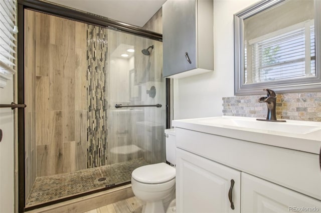 2518 S Dawson Way, Aurora, CO 80014 - full bath with a shower stall, vanity, and backsplash