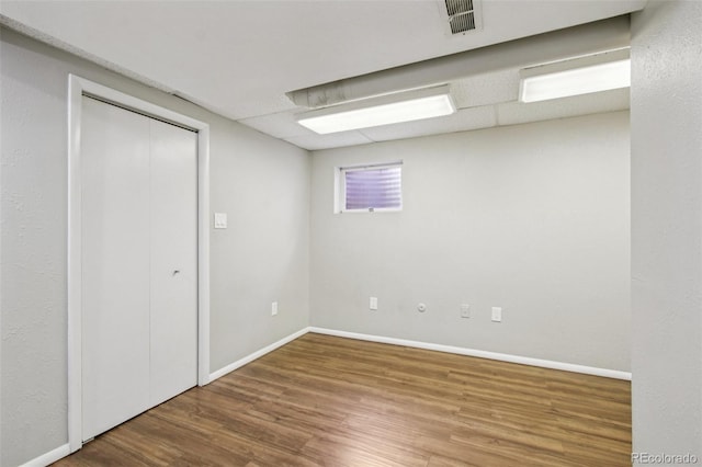 2518 S Dawson Way, Aurora, CO 80014 - below grade area featuring wood finished floors and baseboards