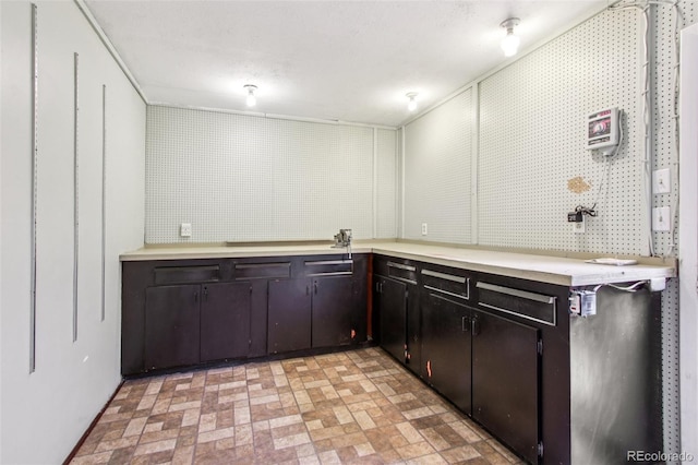 2518 S Dawson Way, Aurora, CO 80014 - kitchen featuring brick patterned floors and light countertops
