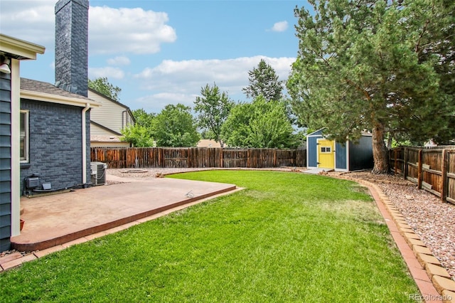 2518 S Dawson Way, Aurora, CO 80014 - fenced backyard featuring a patio area and a storage unit