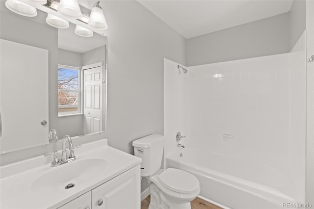 13633 E Yale Ave Unit B, Aurora, CO 80015 - bathroom with toilet, tub / shower combination, and vanity