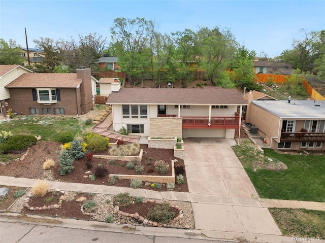 813 Panorama Dr, Colorado Springs, CO 80904 - view of front of home with driveway, an attached garage, a residential view, and stairs
