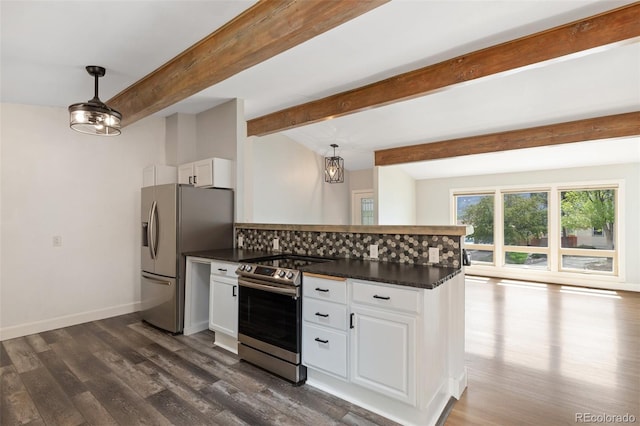 813 Panorama Dr, Colorado Springs, CO 80904 - kitchen with appliances with stainless steel finishes, dark countertops, dark wood-type flooring, white cabinets, and decorative backsplash