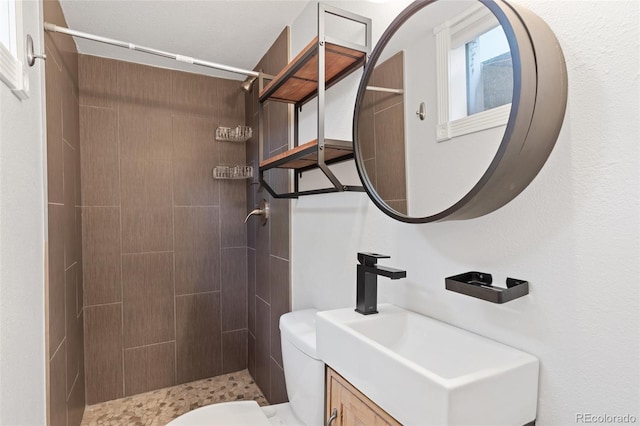 813 Panorama Dr, Colorado Springs, CO 80904 - full bathroom with toilet, a tile shower, and vanity