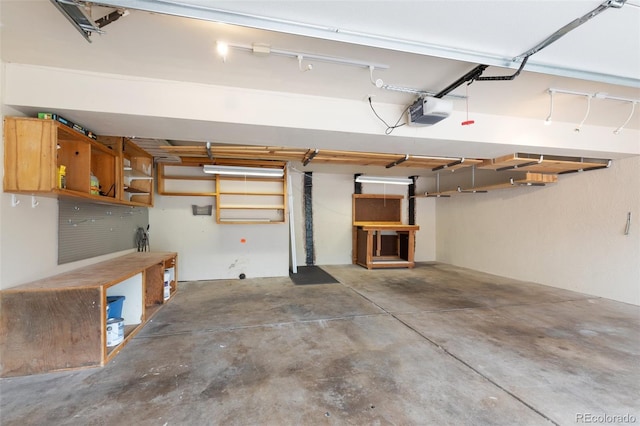 813 Panorama Dr, Colorado Springs, CO 80904 - garage with a garage door opener and a workshop area